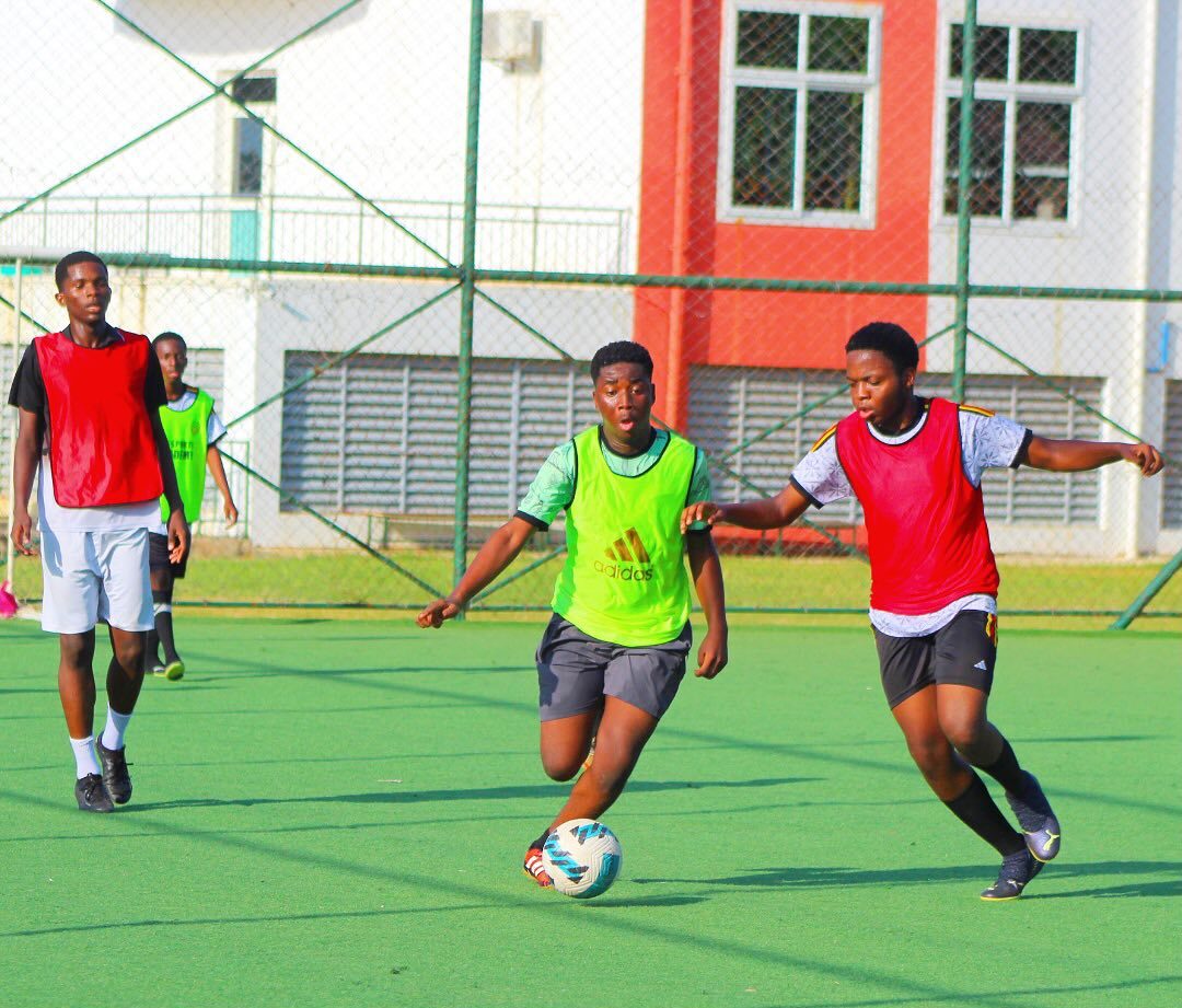 students playing football